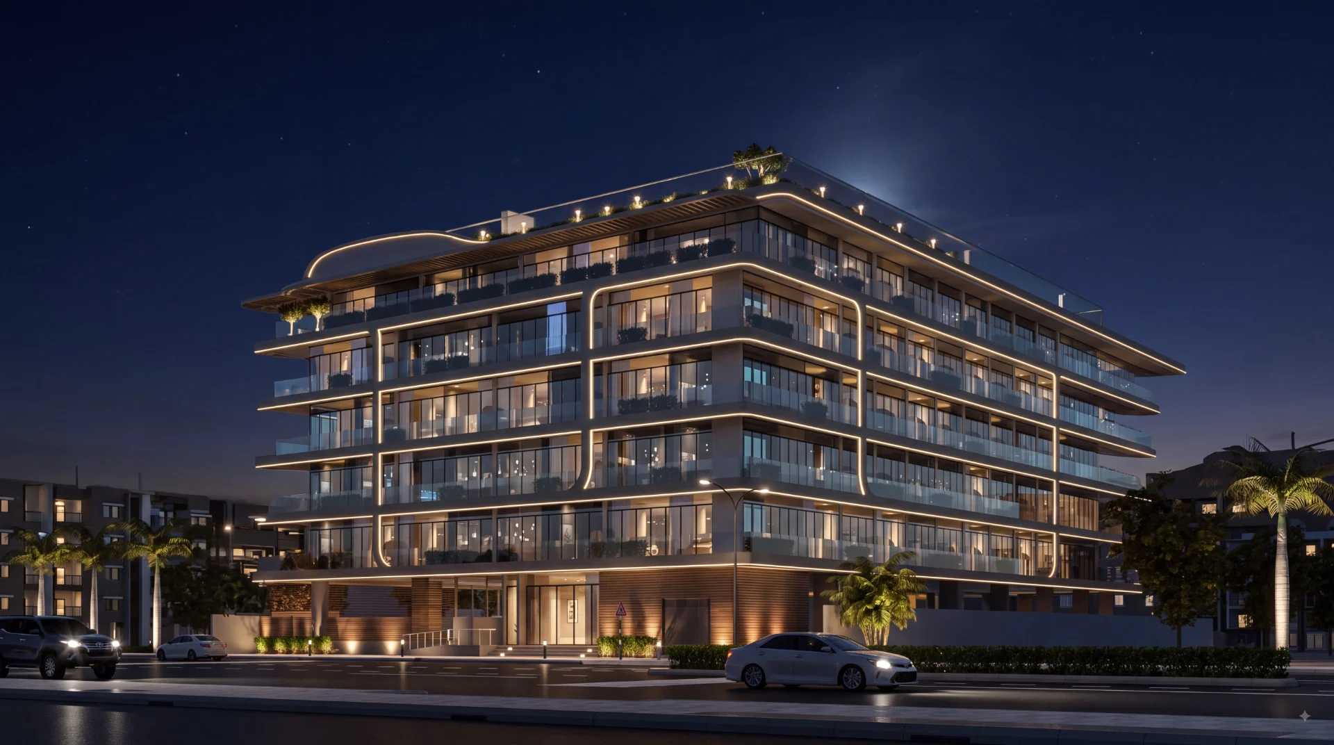 Elevia Residences I, Warsan 4, Dubai - illuminated facade with curved balconies at night